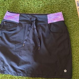 Tuff Athletics Black pullon Skort with purple accent front pockets EUC size Med